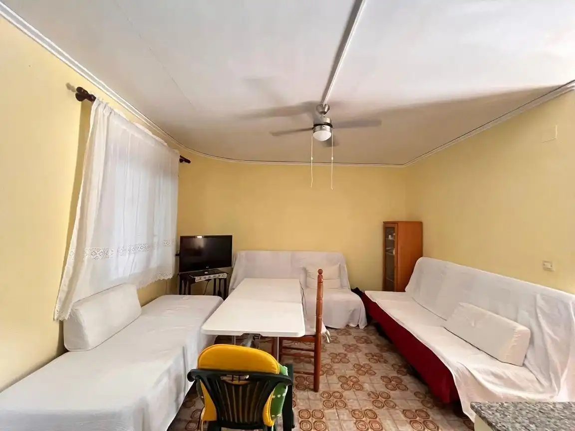 Sala d'estar de Casa adosada en venda en Dénia amb Jardí privat, Terrassa i Piscina comunitària