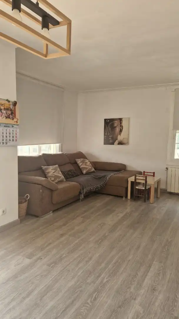 Sala d'estar de Casa adosada en venda en Santa Coloma de Farners amb Calefacció, Jardí privat i Parquet