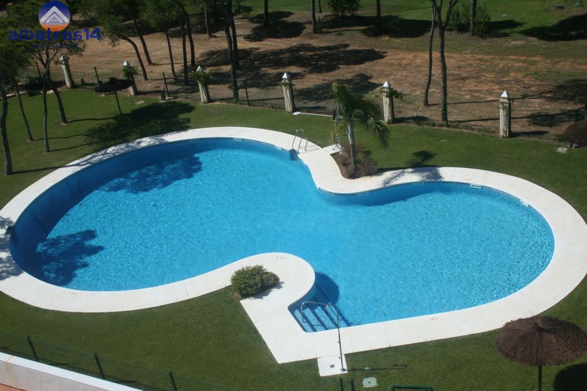 Piscina de Apartament de lloguer en El Portil amb Aire condicionat, Jardí privat i Terrassa