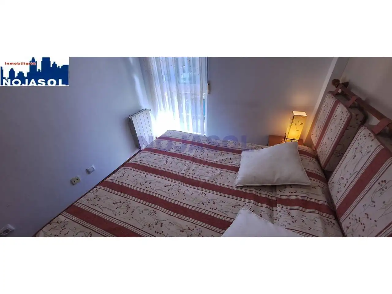 Dormitori de Apartament de lloguer en Noja amb Calefacció, Terrassa i Moblat