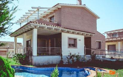 Swimming pool of House or chalet for sale in L'Aldea  with Air Conditioner, Heating and Private garden