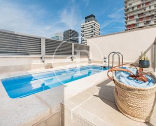 Swimming pool of Attic for sale in  Madrid Capital  with Air Conditioner, Heating and Private garden