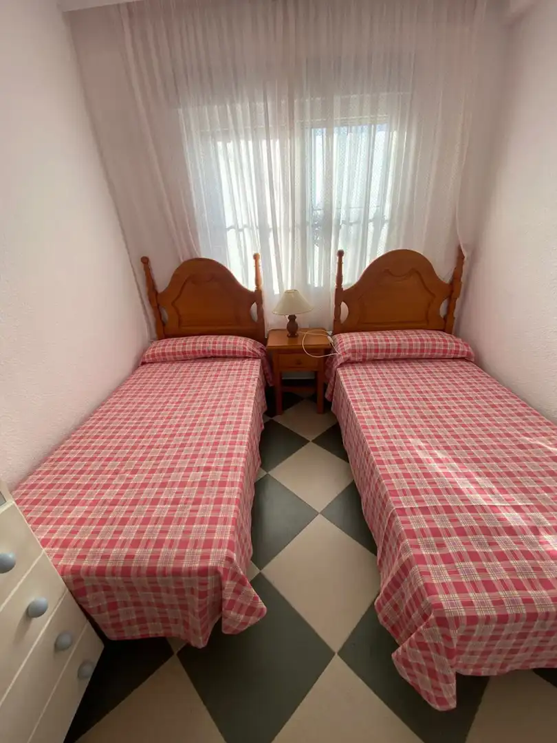 Dormitori de Pis de lloguer en Punta Umbría amb Aire condicionat, Terrassa i Moblat