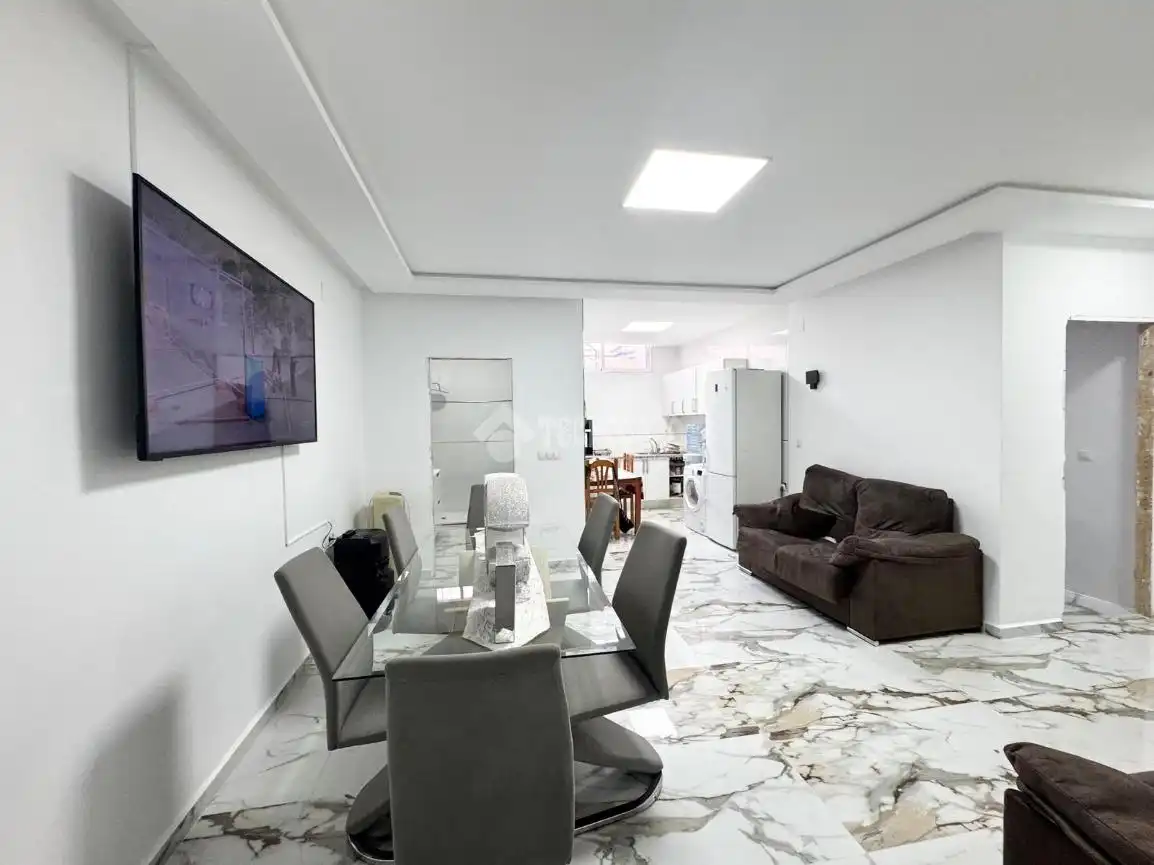 Sala d'estar de Casa adosada en venda en Almería amb Calefacció