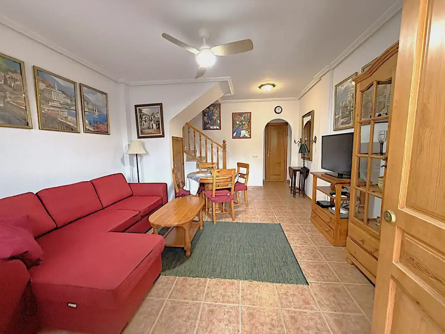 Sala d'estar de Casa adosada en venda en Orihuela amb Aire condicionat, Terrassa i Piscina
