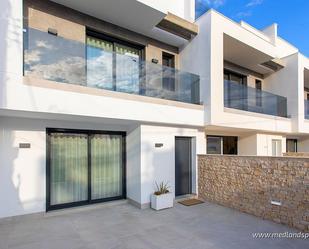 Exterior view of Single-family semi-detached for sale in Pilar de la Horadada  with Private garden, Terrace and Swimming Pool