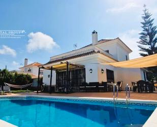 Vista exterior de Casa o xalet en venda en El Portil amb Aire condicionat, Jardí privat i Terrassa