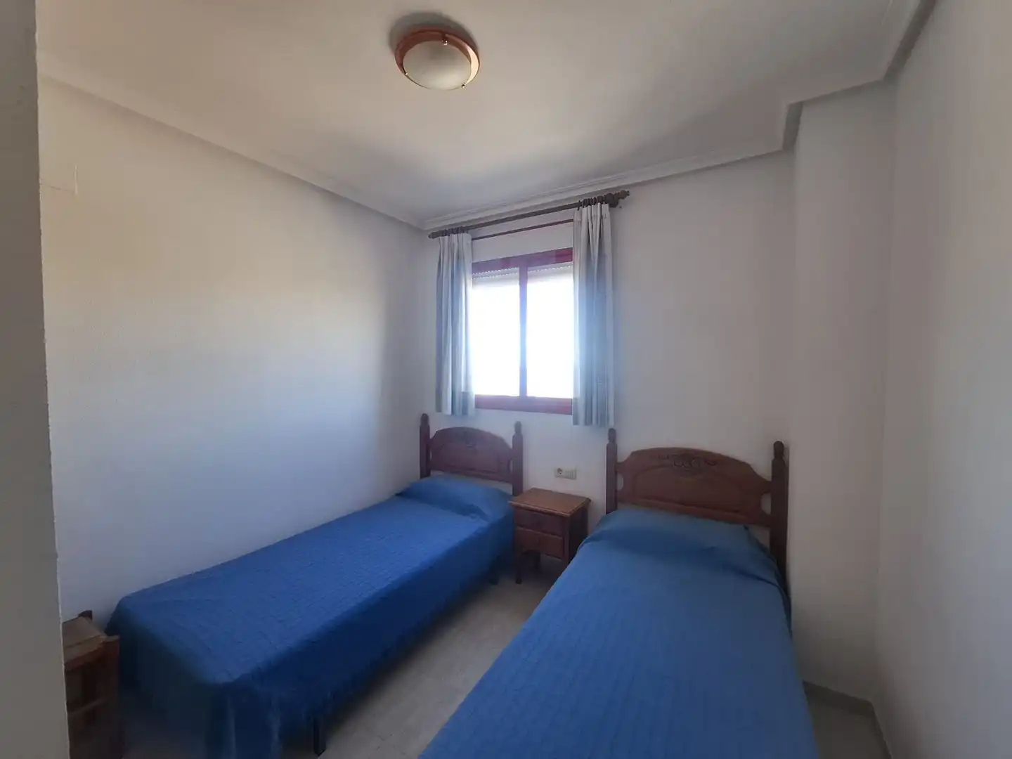 Dormitori de Pis de lloguer en Villajoyosa / La Vila Joiosa amb Aire condicionat, Terrassa i Piscina comunitària