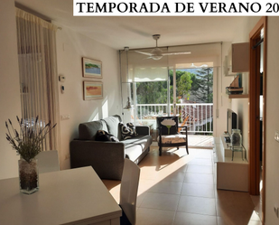 Sala d'estar de Apartament de lloguer en Palamós amb Aire condicionat i Terrassa