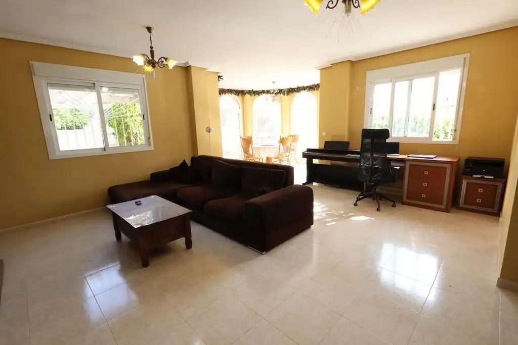 Sala d'estar de Casa adosada en venda en Rojales amb Aire condicionat, Jardí privat i Terrassa