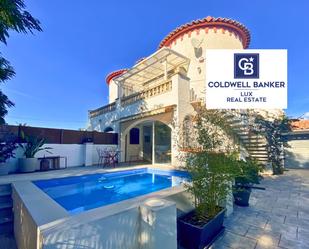 Swimming pool of Single-family semi-detached for sale in Empuriabrava  with Air Conditioner, Heating and Terrace