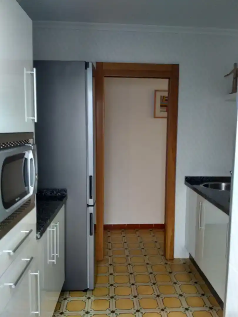 Cuina de Casa adosada de lloguer en Punta Umbría amb Aire condicionat, Moblat i Rentadora