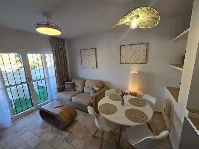 Sala de estar de Casa adosada en venta en Islantilla con Aire acondicionado, Calefacción y Terraza