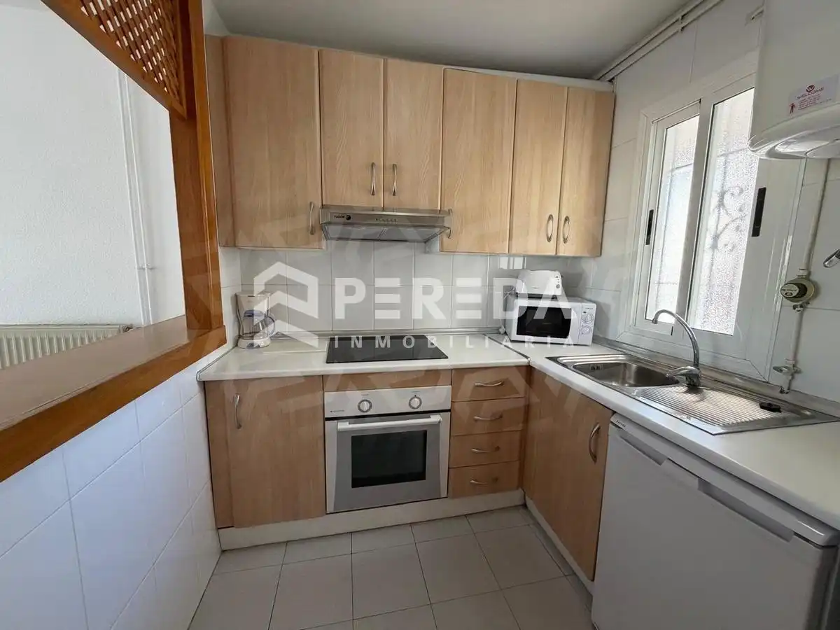 Cocina de Apartamento en venta en Roquetas de Mar con Aire acondicionado, Jardín privado y Terraza