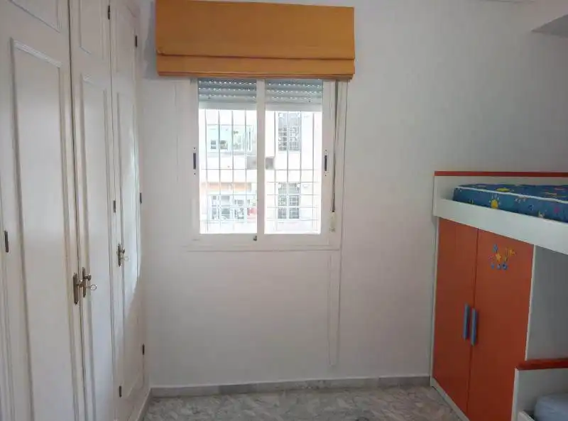 Bedroom of Flat for sale in Tomares  with Air Conditioner, Terrace and Community pool