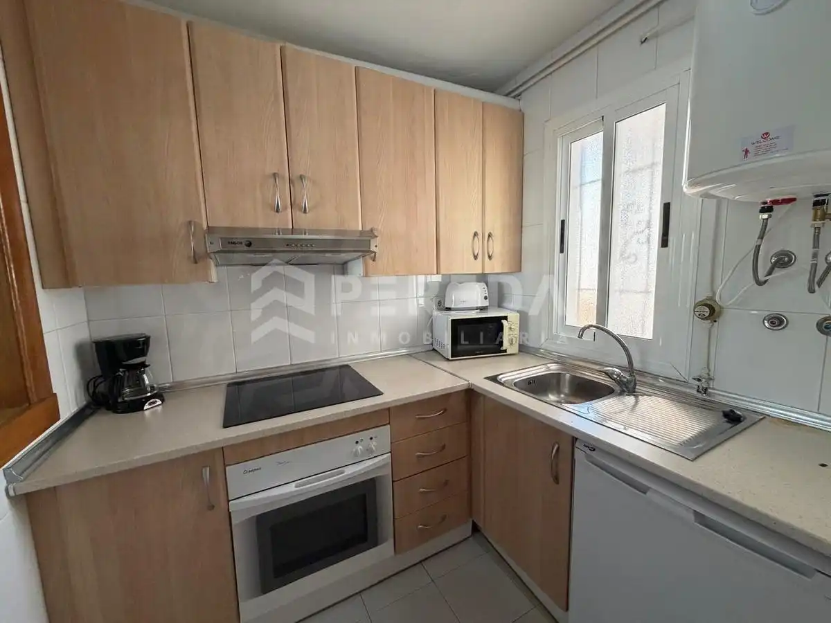 Cocina de Apartamento en venta en Roquetas de Mar con Aire acondicionado, Jardín privado y Terraza