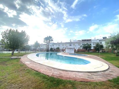 Jardí de Casa adosada en venda en Aljaraque amb Aire condicionat i Piscina