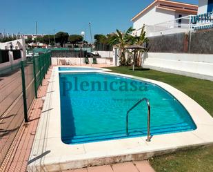 Swimming pool of Single-family semi-detached for sale in El Portil  with Private garden, Terrace and Community pool