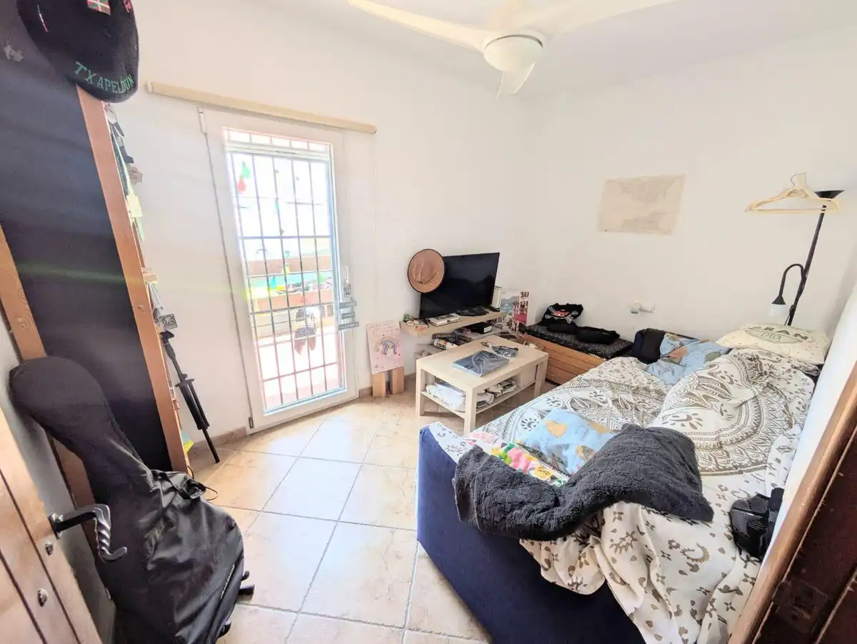 Sala d'estar de Casa adosada en venda en Torremolinos amb Aire condicionat, Calefacció i Jardí privat