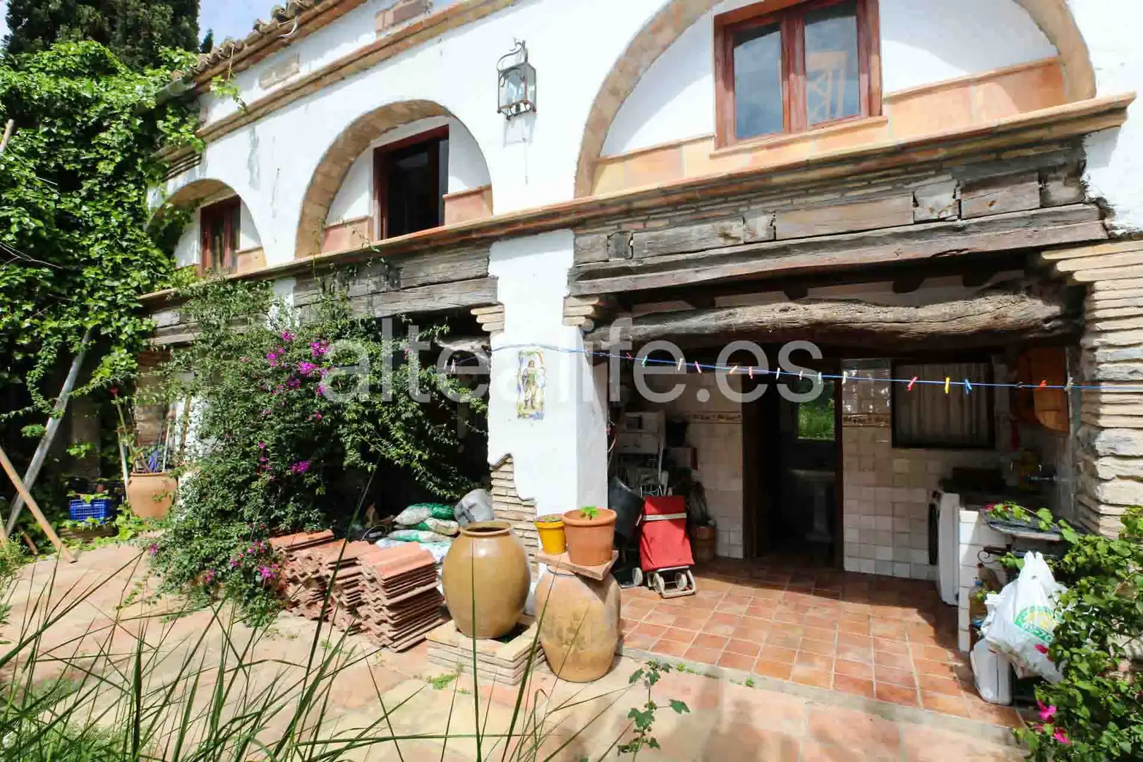 Garten von Einfamilien-Reihenhaus zum Verkauf in Gandia mit Privatgarten, Terrasse und Abstellraum