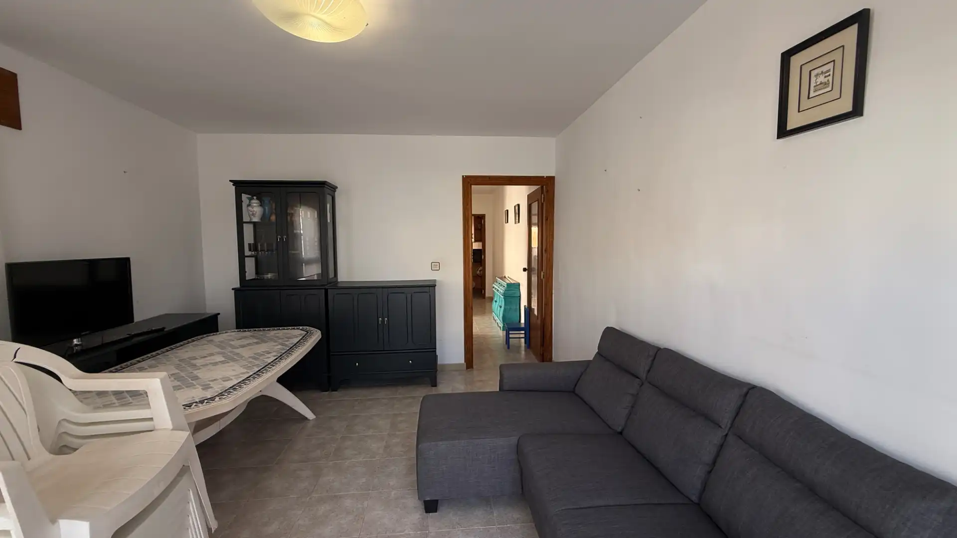 Sala de estar de Casa adosada en venta en Águilas con Jardín privado, Terraza y Trastero