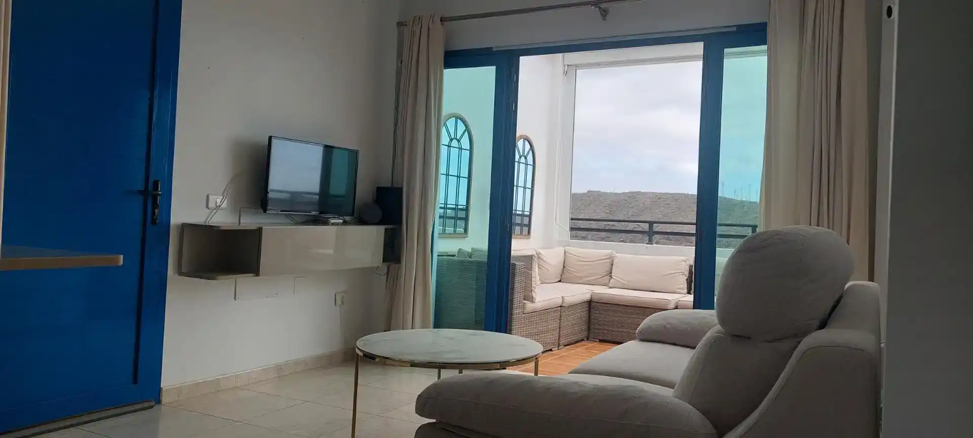 Living room of Flat for sale in Mogán  with Air Conditioner, Private garden and Swimming Pool