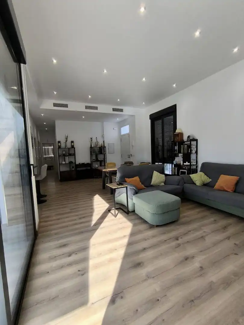 Sala de estar de Casa o chalet en venta en Umbrete con Aire acondicionado, Parquet y Trastero