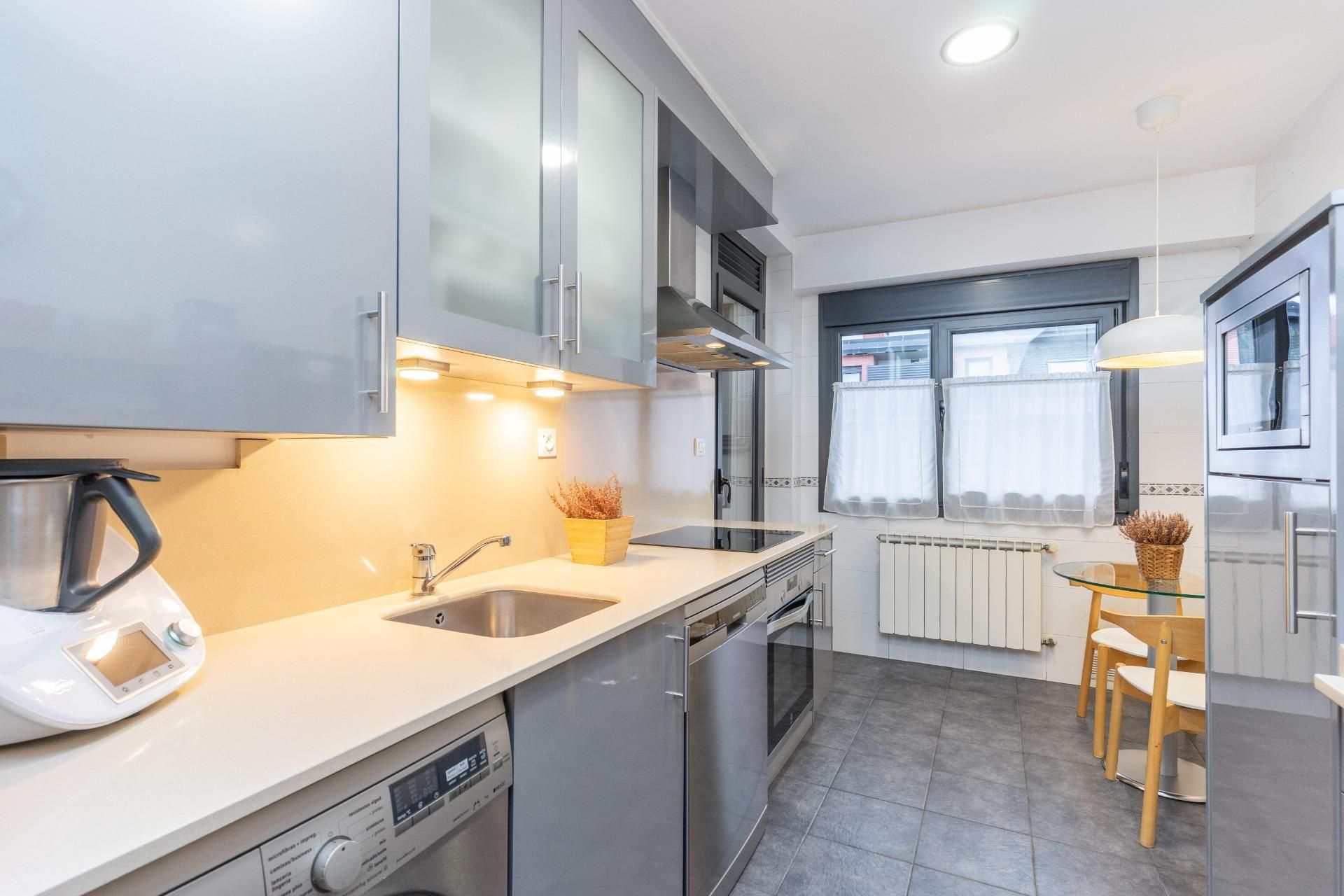 Kitchen of Flat for sale in Oviedo   with Heating, Parquet flooring and Storage room