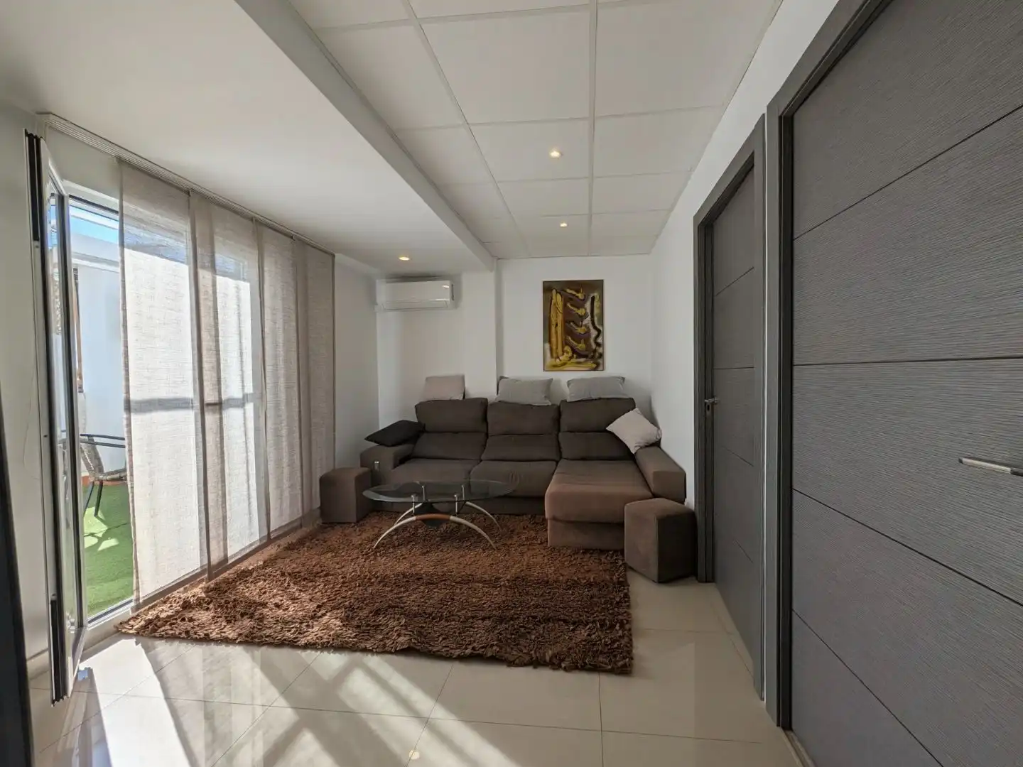 Sala d'estar de Àtic de lloguer en Camins al Grau