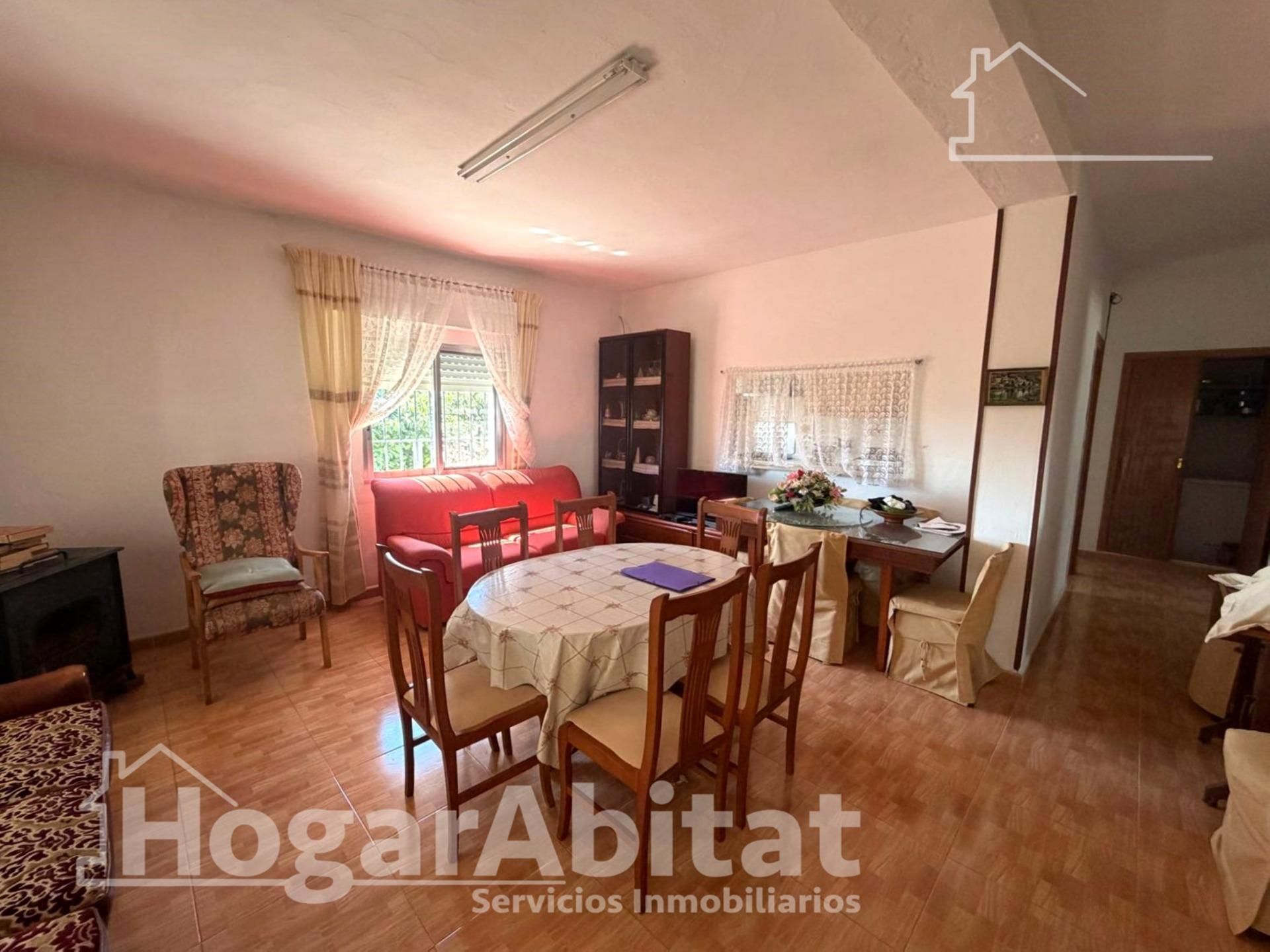 Sala d'estar de Casa o xalet en venda en Torrent amb Aire condicionat, Jardí privat i Terrassa