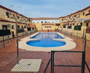Swimming pool of Single-family semi-detached for sale in Cantillana  with Terrace, Balcony and Community pool