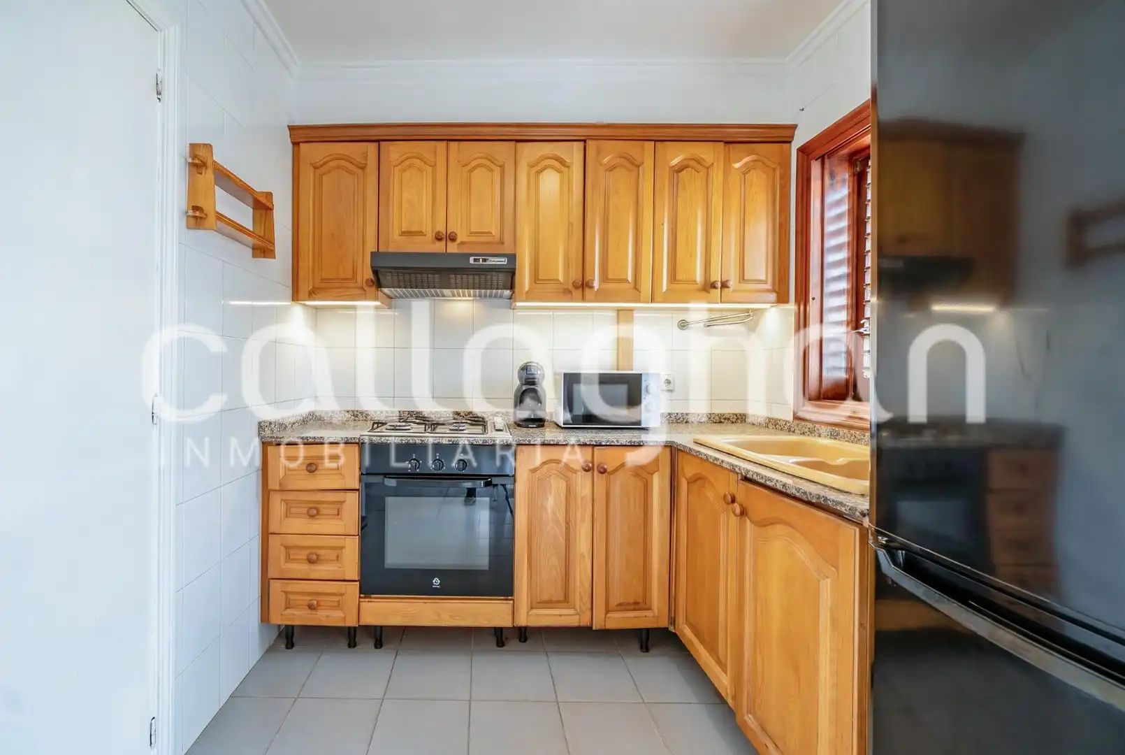 Cuina de Casa adosada en venda en Sagunto / Sagunt amb Aire condicionat, Calefacció i Jardí privat