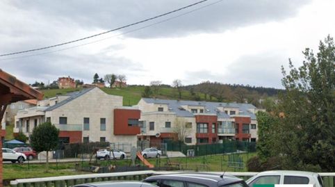 ORUÑA: Bajo con jardín de 2 dorm.