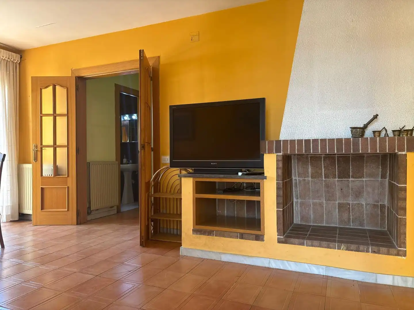 Sala de estar de Casa adosada en venta en Sant Celoni con Calefacción, Jardín privado y Terraza