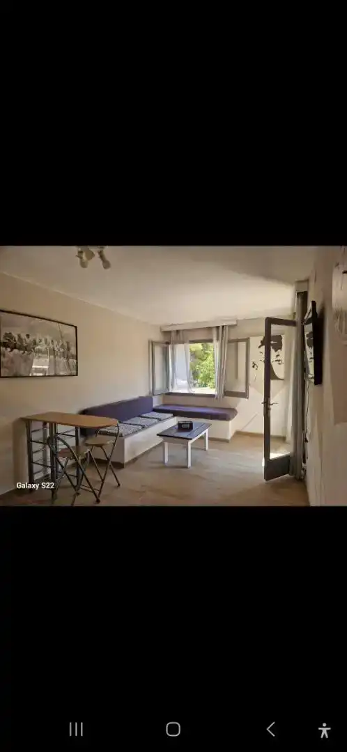 Sala d'estar de Casa adosada en venda en L'Ametlla de Mar  amb Aire condicionat, Jardí privat i Parquet