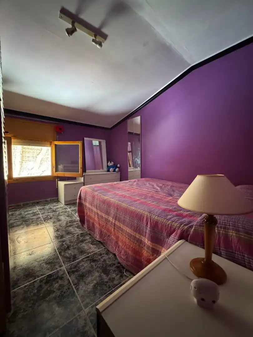 Dormitori de Casa adosada en venda en Alcañiz amb Terrassa, Traster i Piscina comunitària