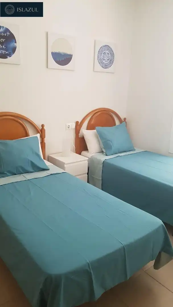 Dormitori de Casa adosada en venda en Isla Cristina amb Jardí privat, Terrassa i Moblat