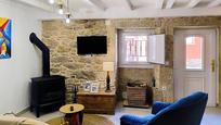 Sala d'estar de Casa adosada en venda en Porto do Son amb Terrassa