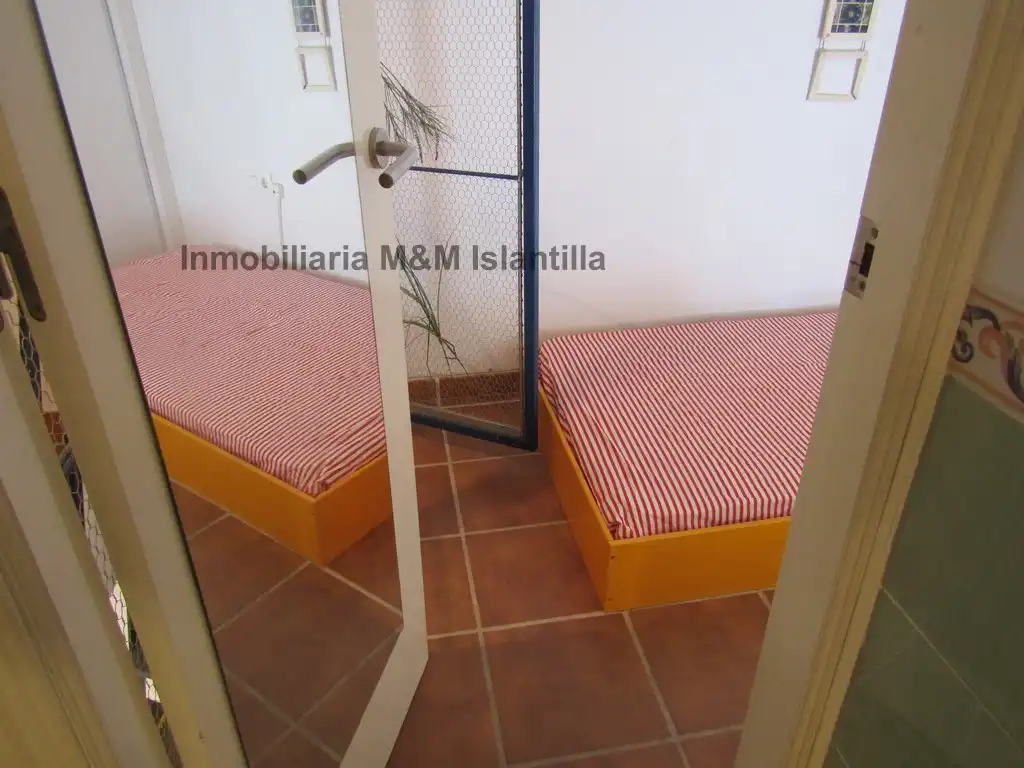 Habitación de Casa adosada en venta en Islantilla con Terraza, Trastero y Amueblado