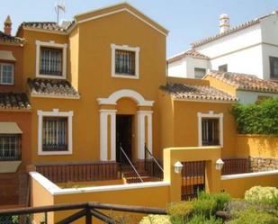 Exterior view of Single-family semi-detached for sale in Estepona  with Air Conditioner, Swimming Pool and Community pool