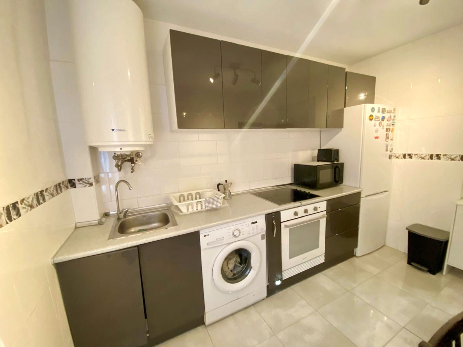 Kitchen of Flat for sale in Gijón   with Heating, Parquet flooring and Oven