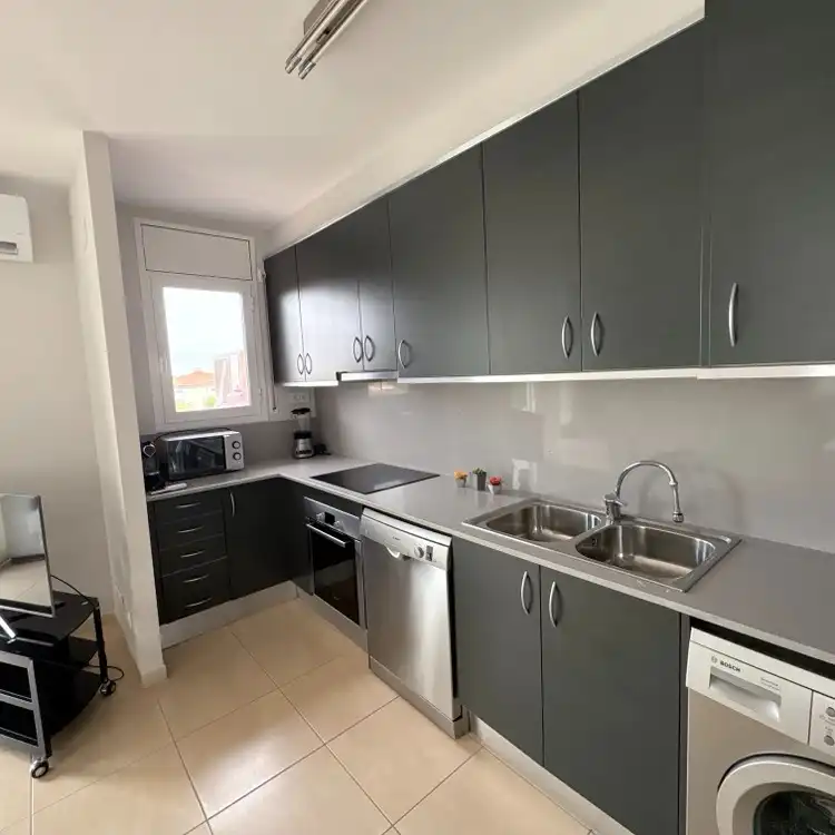 Cuina de Apartament en venda en Mont-roig del Camp amb Aire condicionat, Moblat i Piscina comunitària