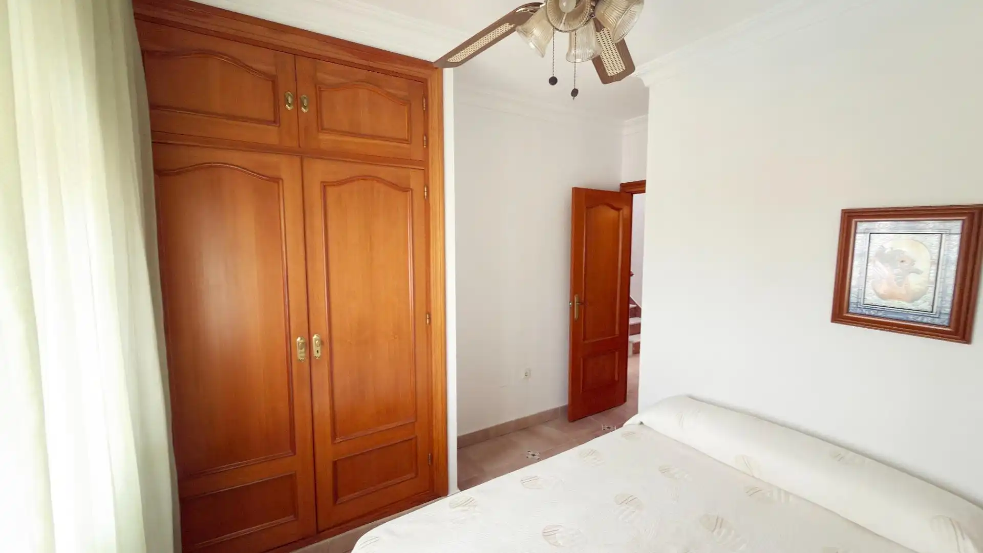 Habitación de Casa adosada de alquiler en Punta Umbría con Terraza y Piscina comunitaria
