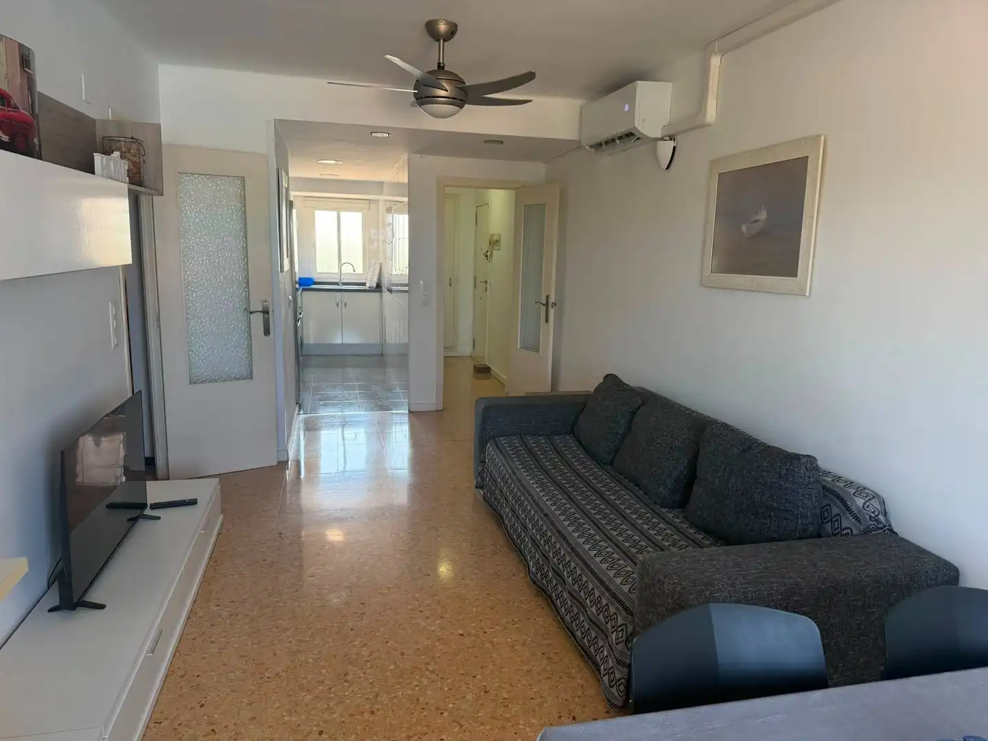 Sala d'estar de Apartament de lloguer en El Puig de Santa Maria amb Aire condicionat, Moblat i Piscina comunitària