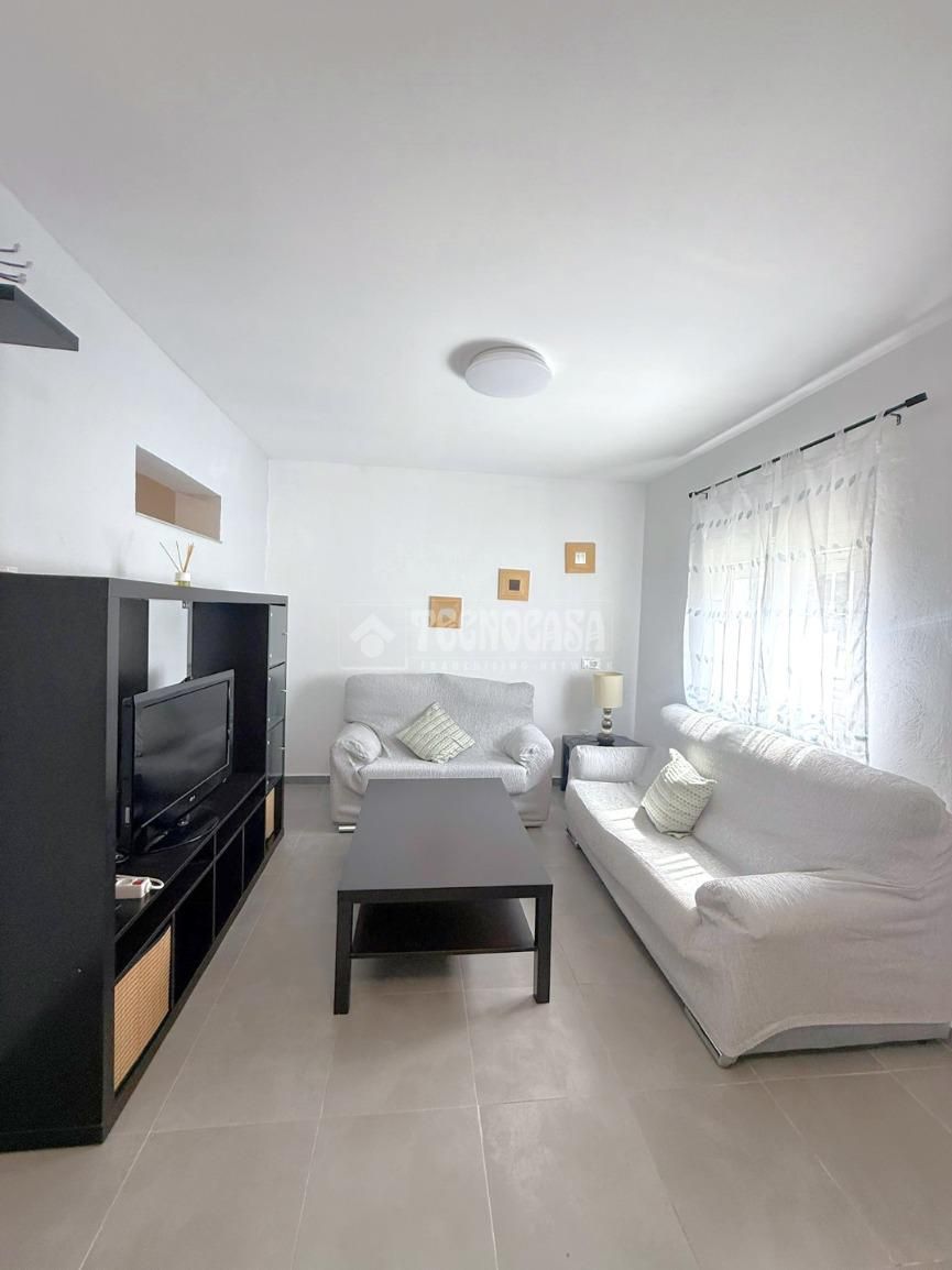 Sala d'estar de Casa adosada en venda en Badajoz Capital amb Aire condicionat i Terrassa