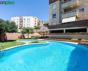 Swimming pool of Attic for sale in  Granada Capital  with Heating, Private garden and Terrace