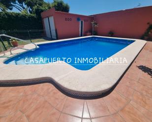 Piscina de Casa o xalet de lloguer en El Puerto de Santa María amb Aire condicionat, Jardí privat i Traster