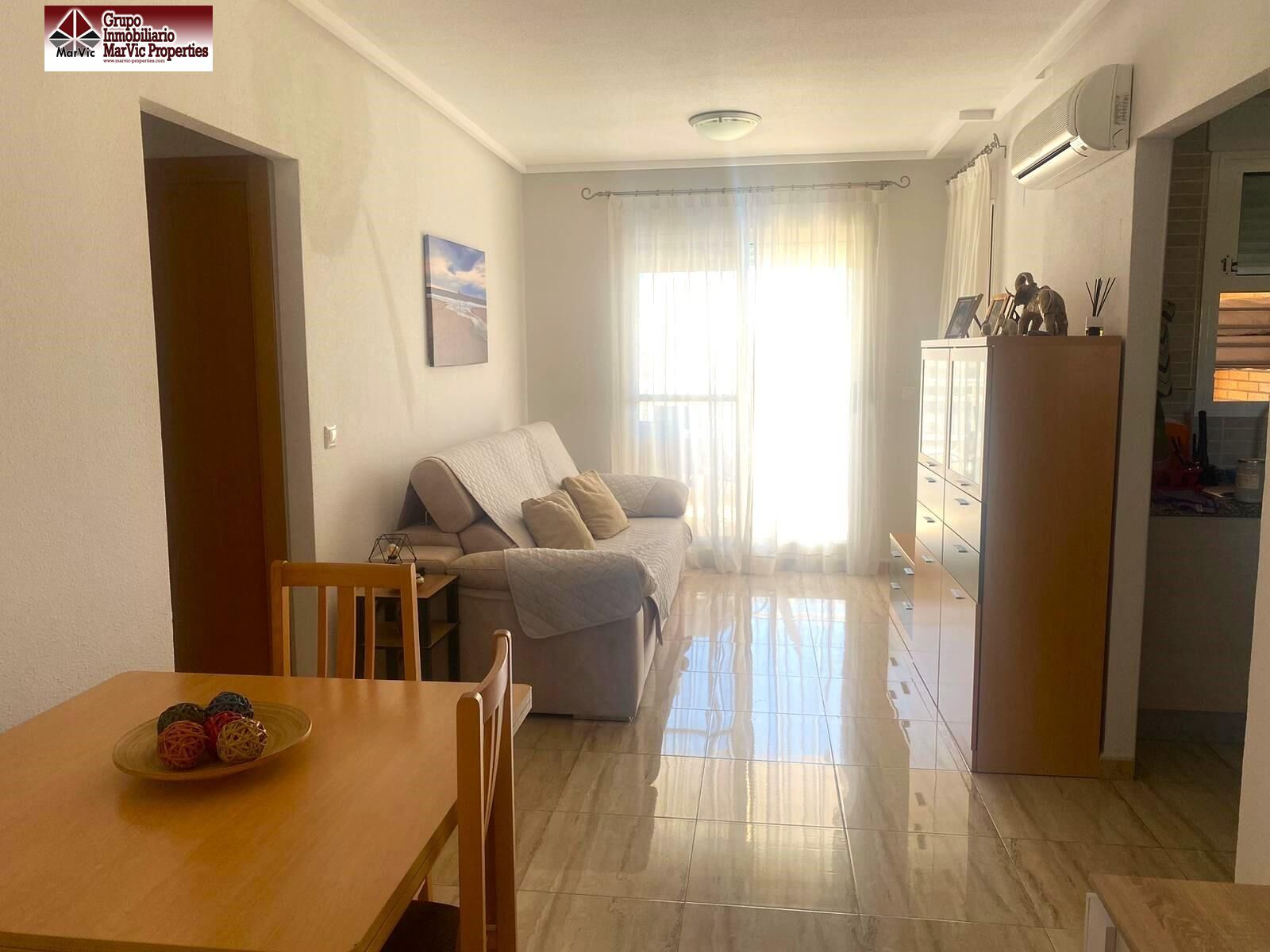 Sala d'estar de Apartament en venda en Benidorm amb Aire condicionat, Terrassa i Piscina comunitària