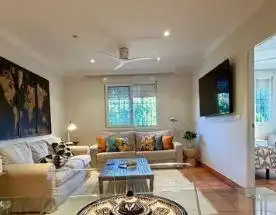 Sala d'estar de Casa o xalet en venda en Punta Umbría amb Aire condicionat, Jardí privat i Parquet