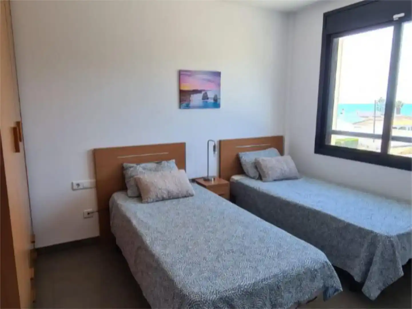 Dormitori de Apartament de lloguer en Alcanar amb Aire condicionat, Jardí privat i Piscina